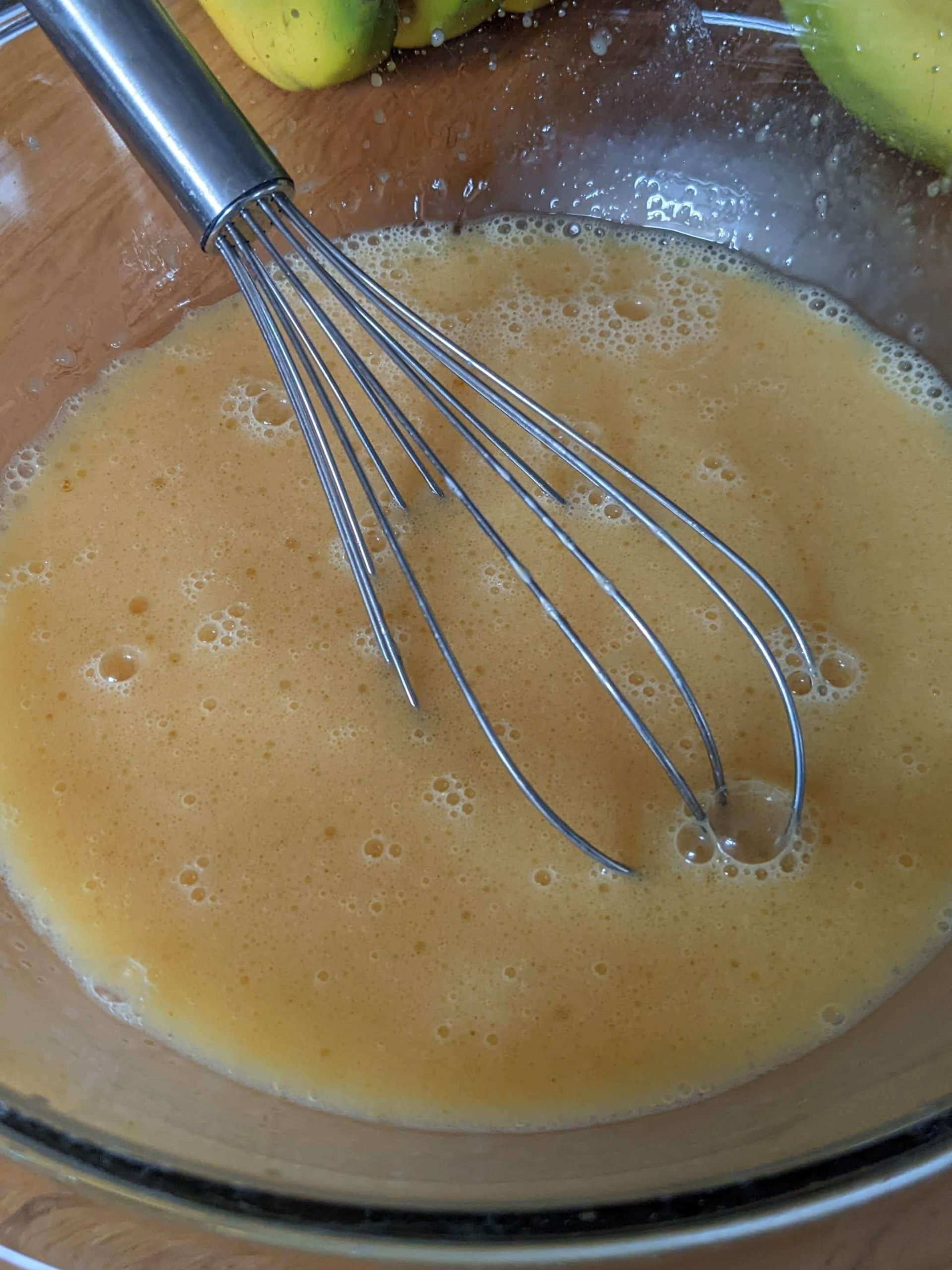 raw eggs scrambled with a whisk