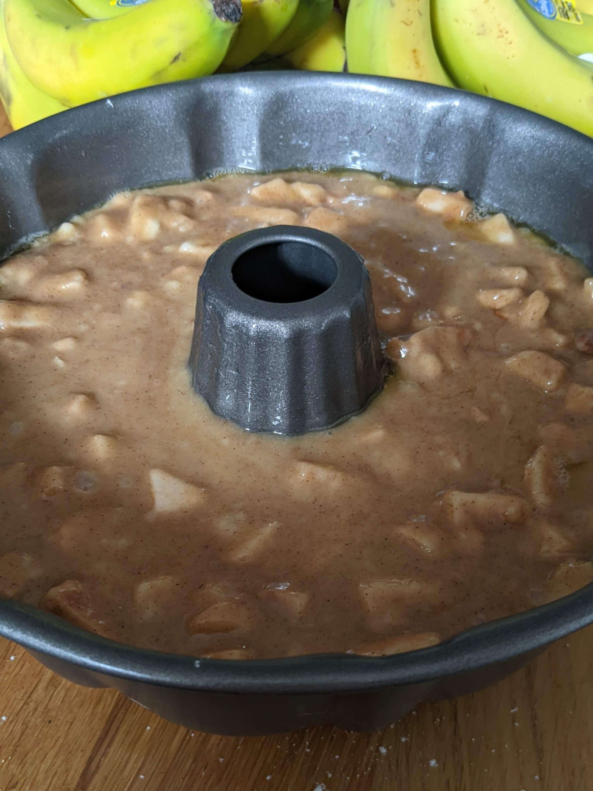 apples in batter in a bundt pan
