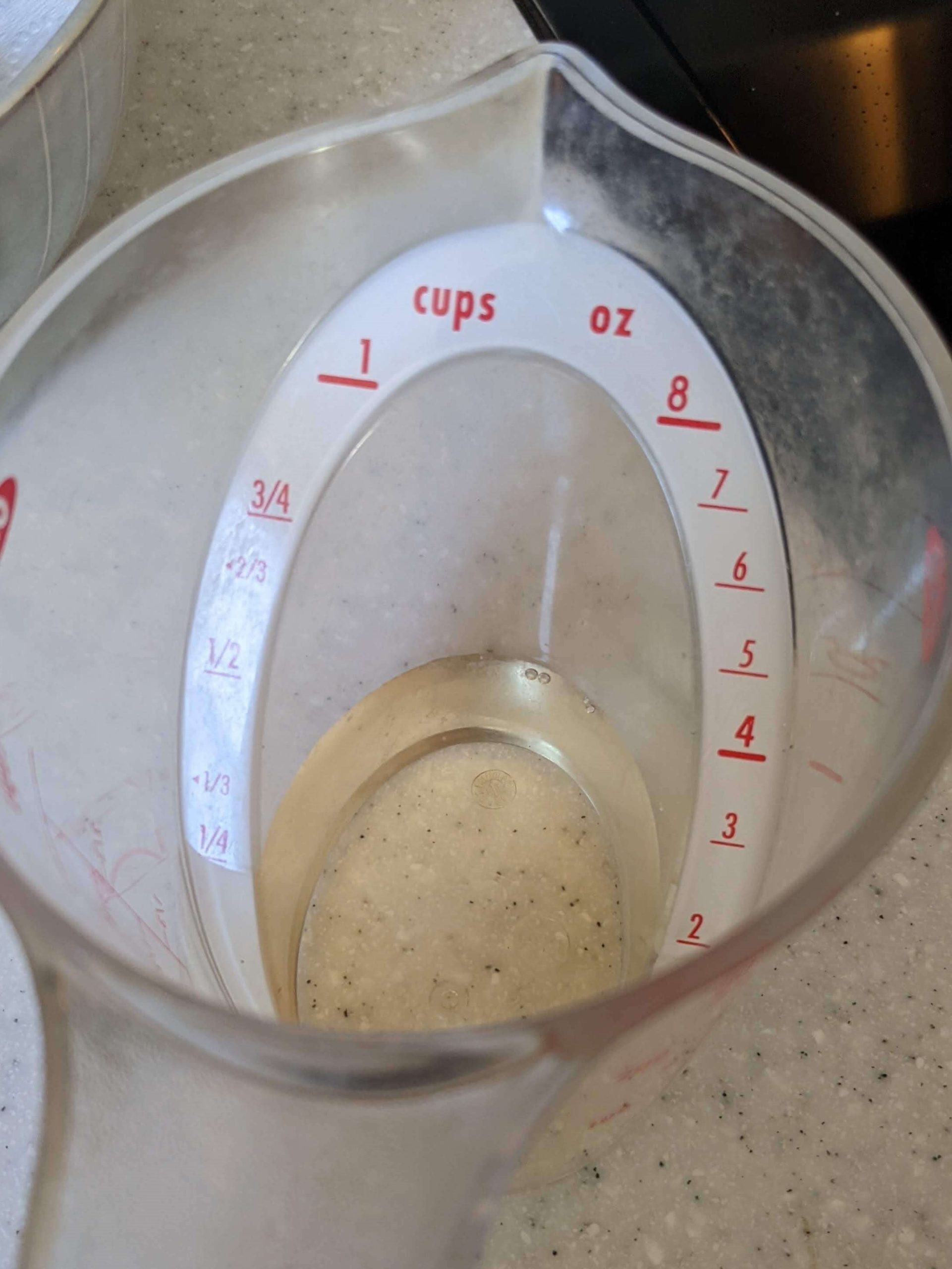 measuring cup of white wine