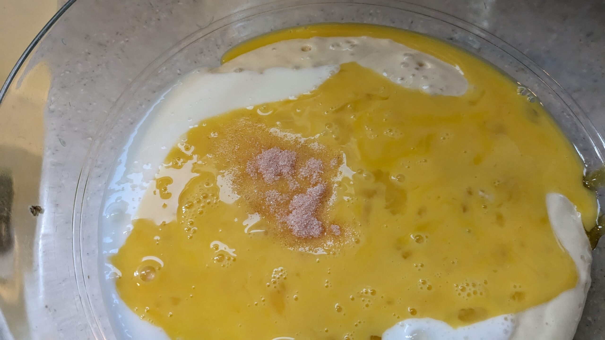 pink salt in raw scrambled eggs on top of sourdough discard