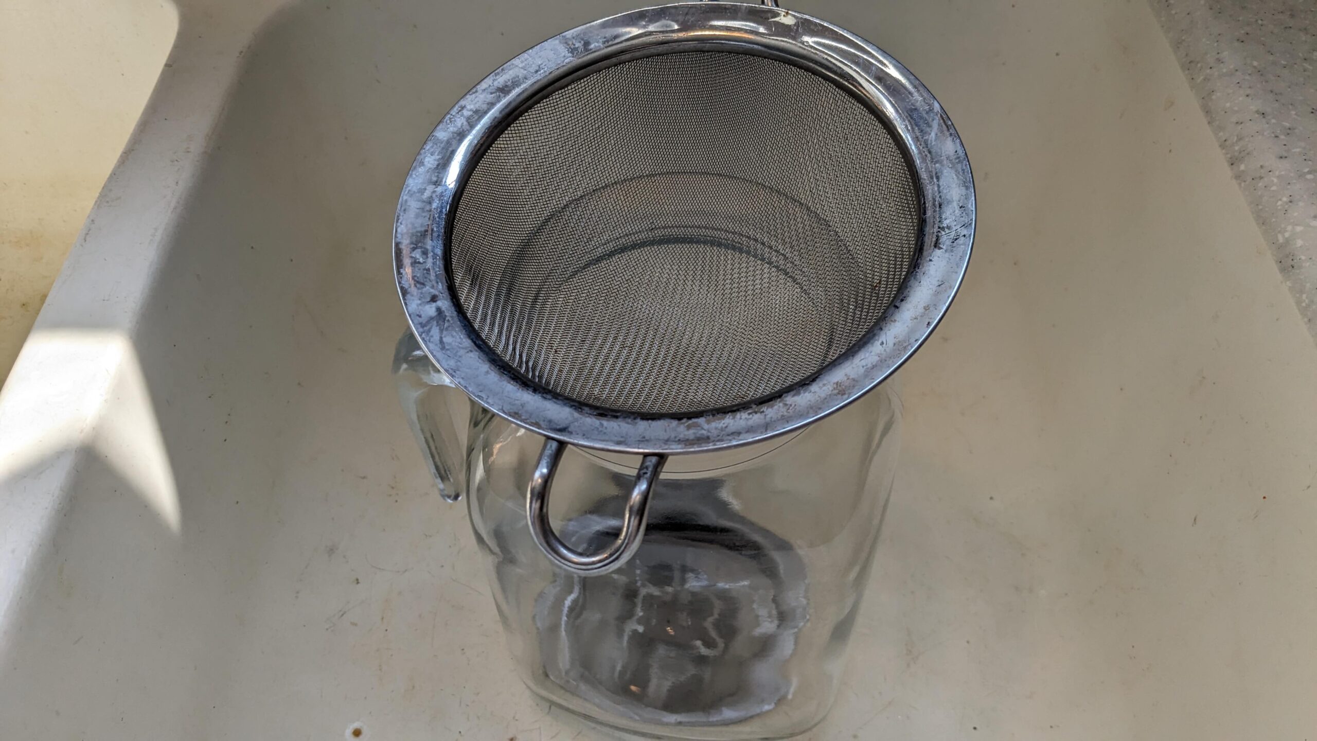 mesh strainer over a glass pitcher