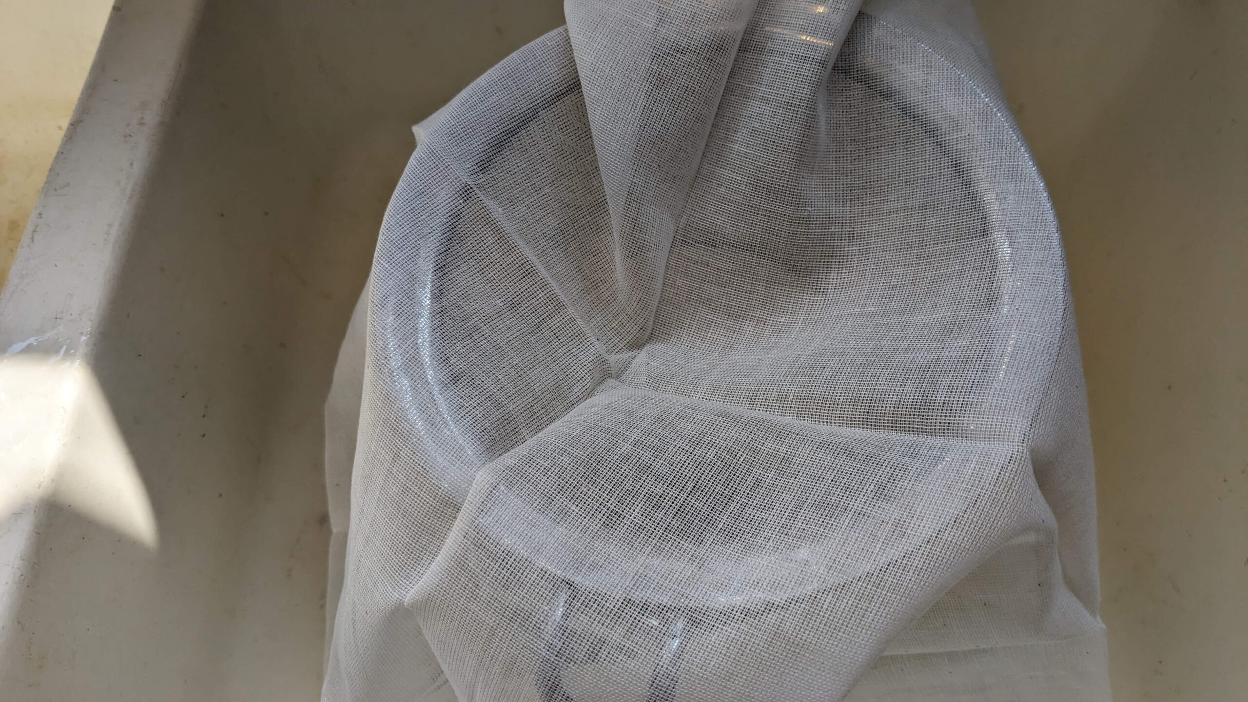 cheesecloth over a mesh strainer