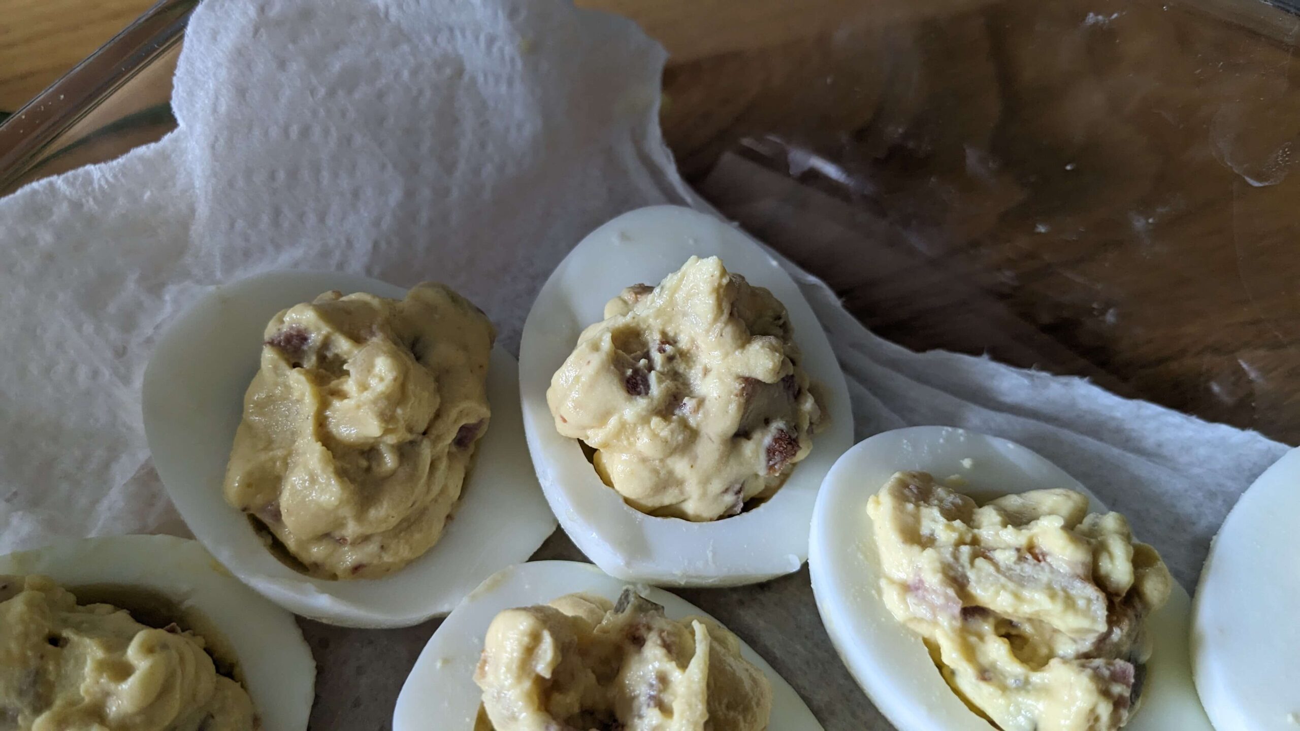 close up of deviled eggs with bacon