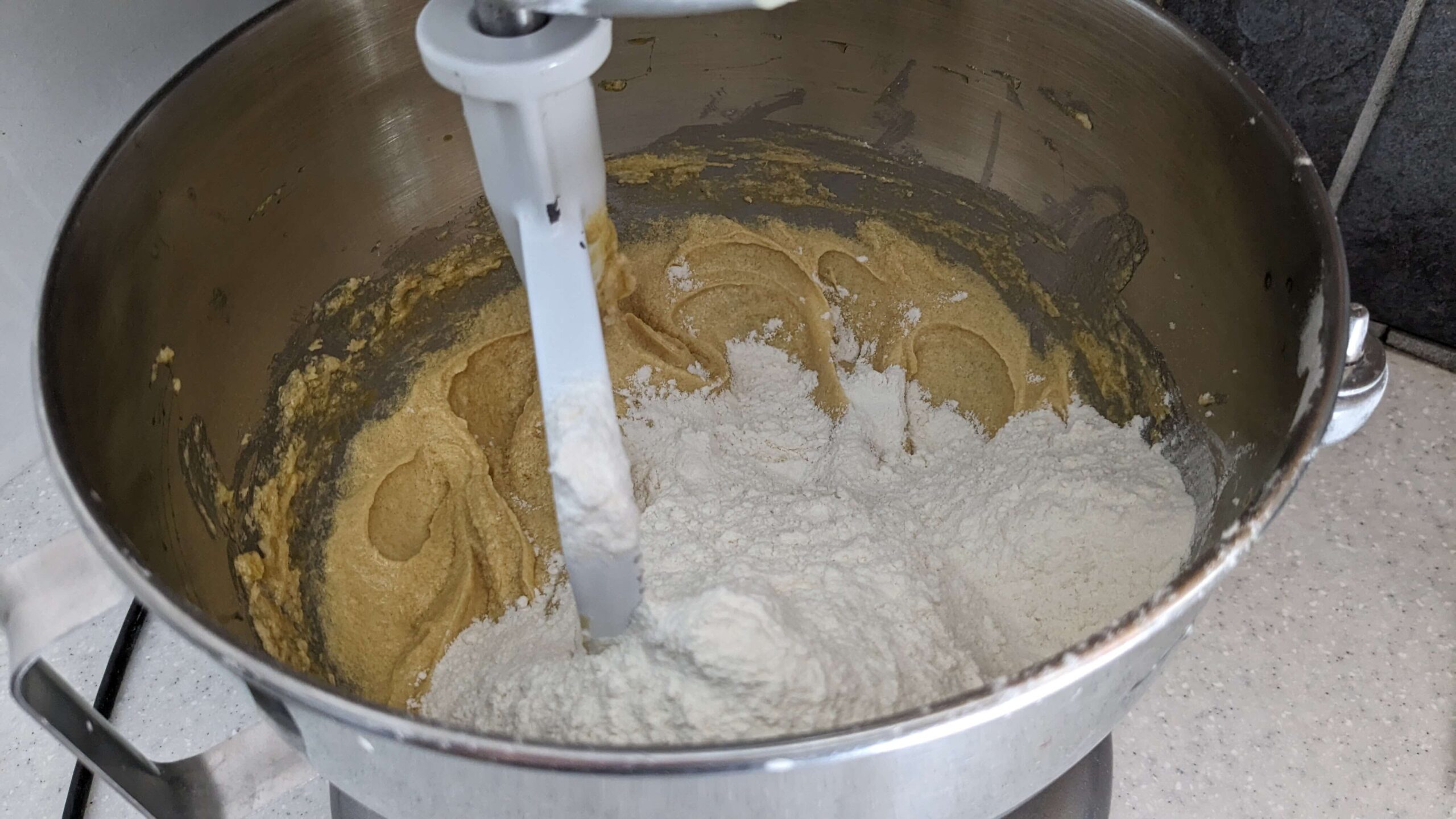 kitchen aid mixer mixing flour into cookie dough