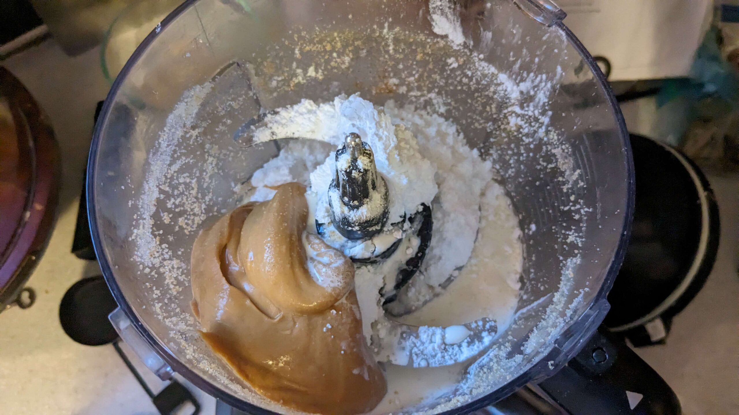 creamy peanut butter and powdered sugar in a food processor