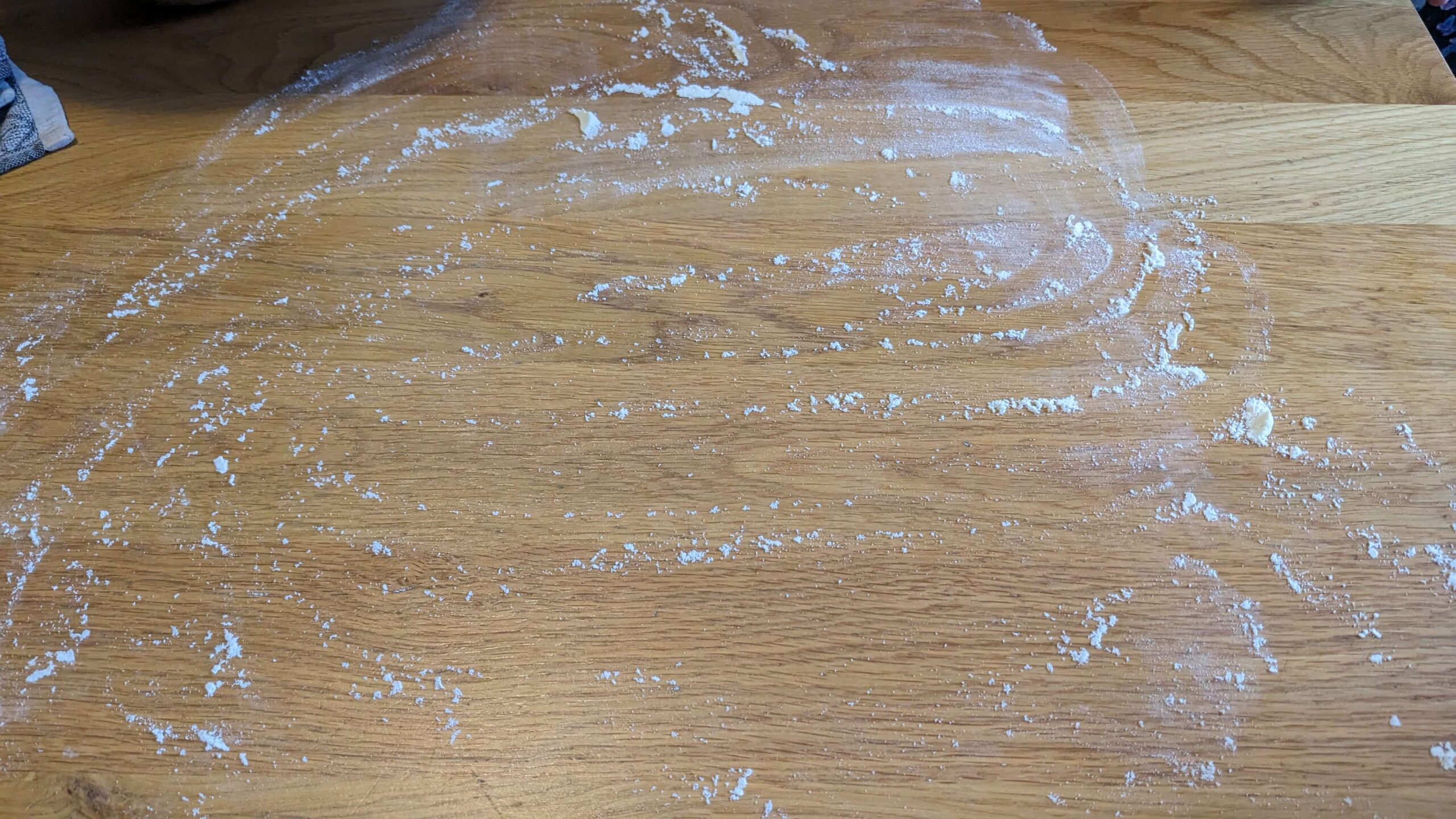 flour lightly dusted on a wooden surface