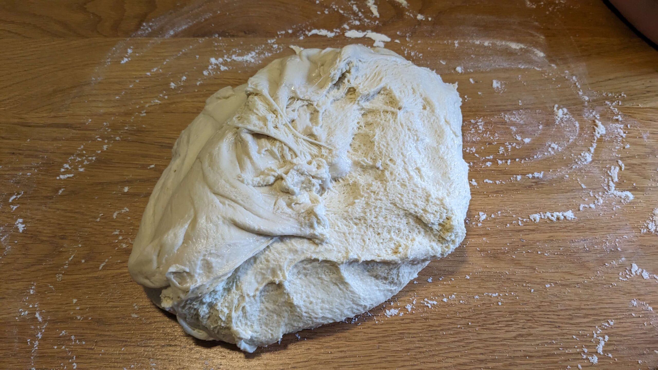bread dough on a wooden countertop