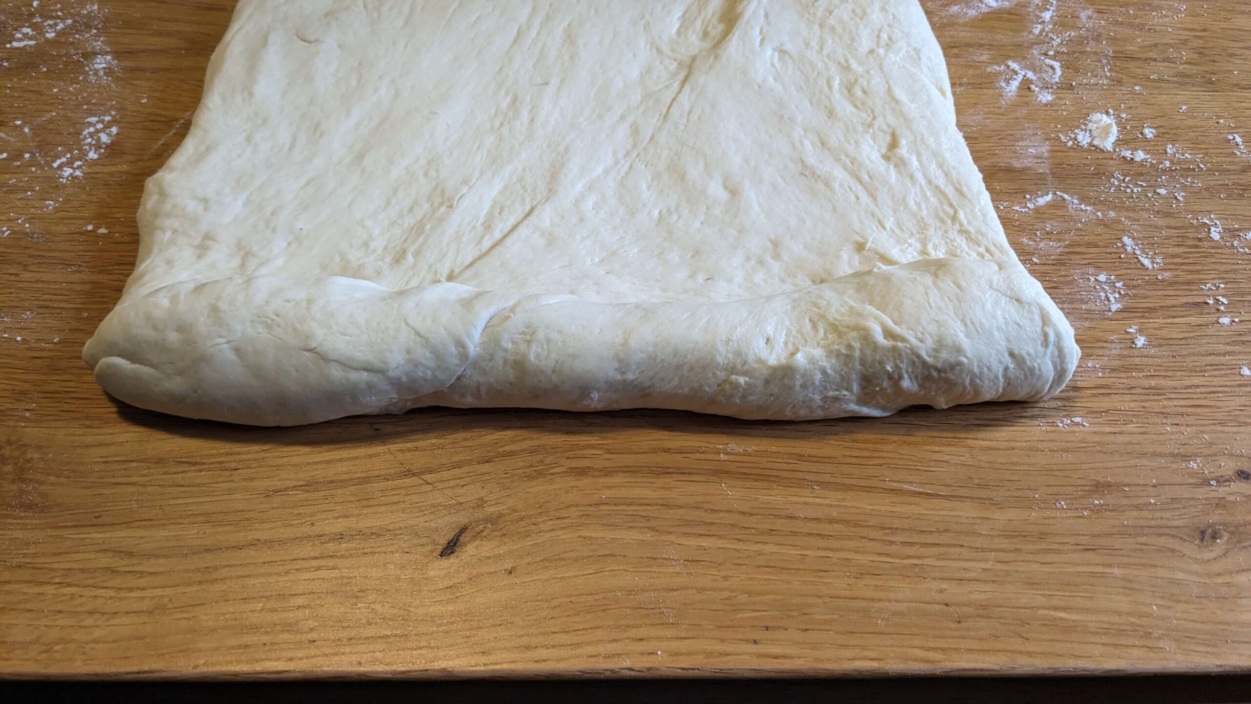 rolled up edge of bread dough