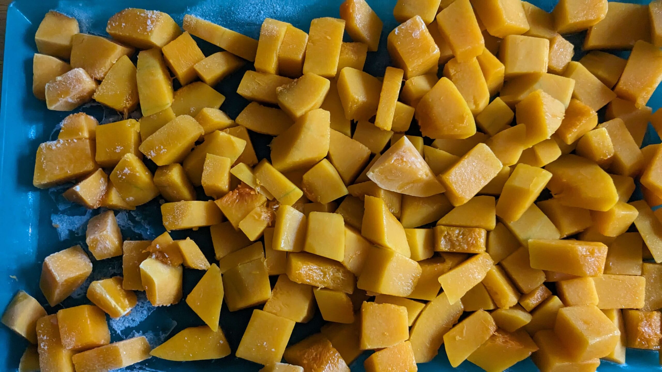 frozen diced butternut squash on a play 