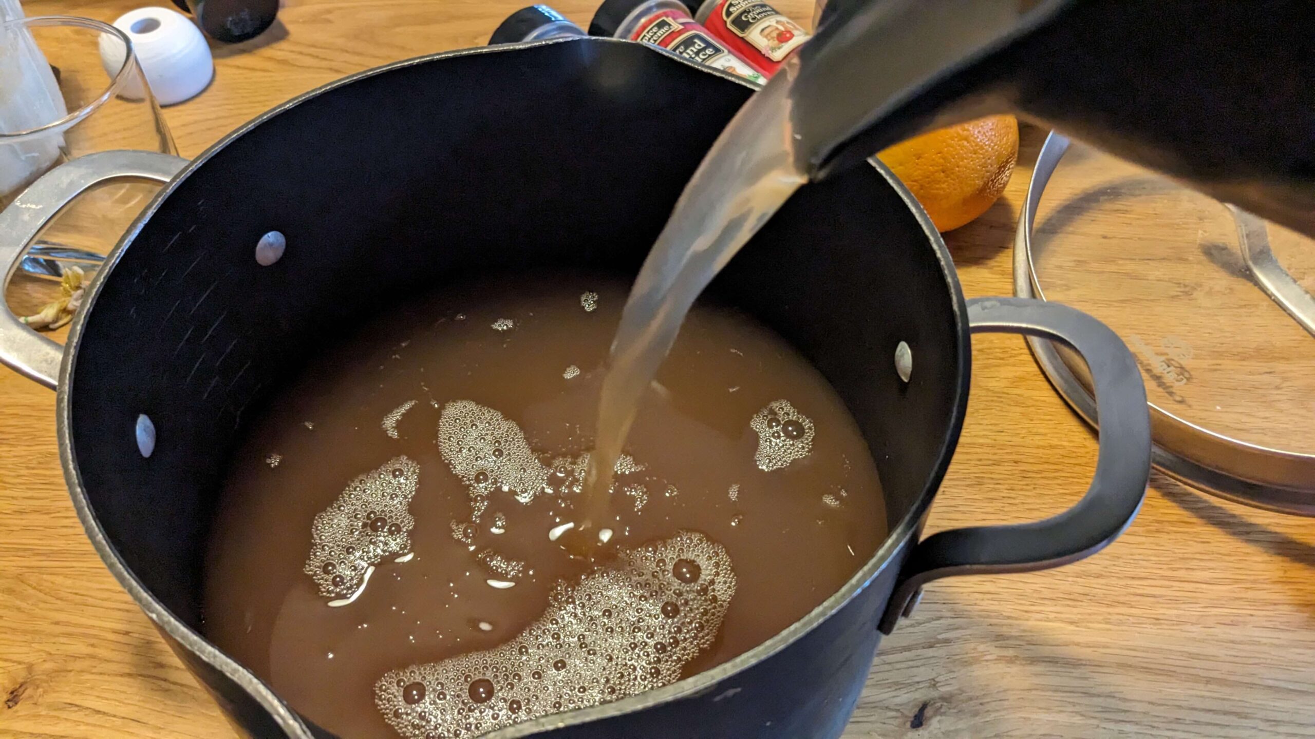 apple juice pouring into a pot