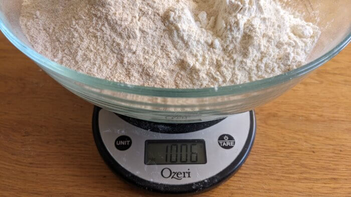 1006 grams of flour in a bowl on a scale