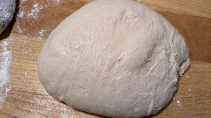 sourdough boulle resting on the counter with gas bubbles