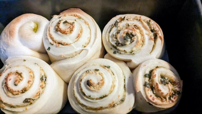 White cheddar cheese and chive rolls in a rectangular baking dish