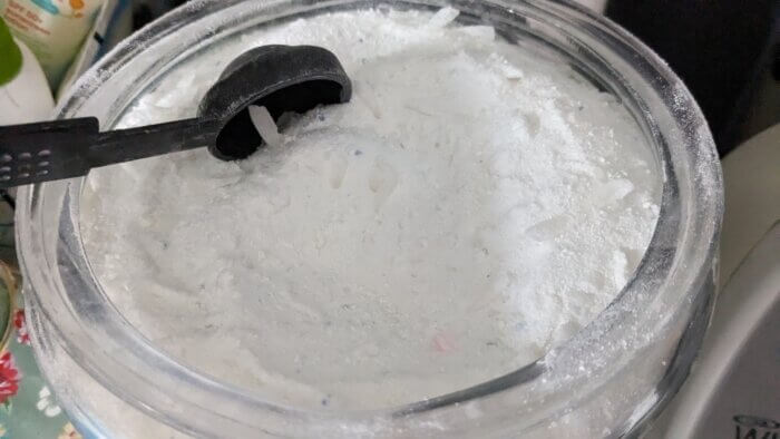 tablespoon scoop in a jar of homemade powdered laundry detergent