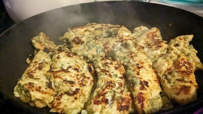 chicken tenders cooking in a pan