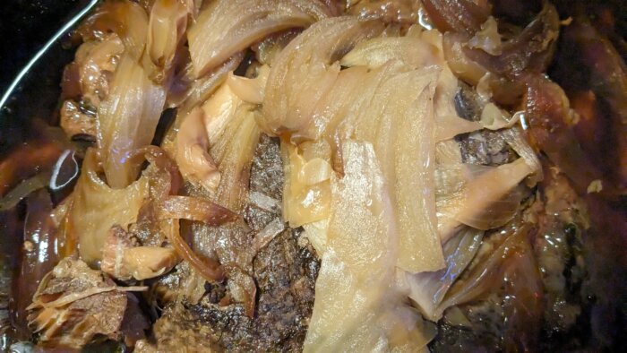 cooked chinese pot roast with cooked onions on top