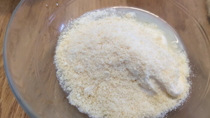 Parmesan cheese with lemon juice in a bowl