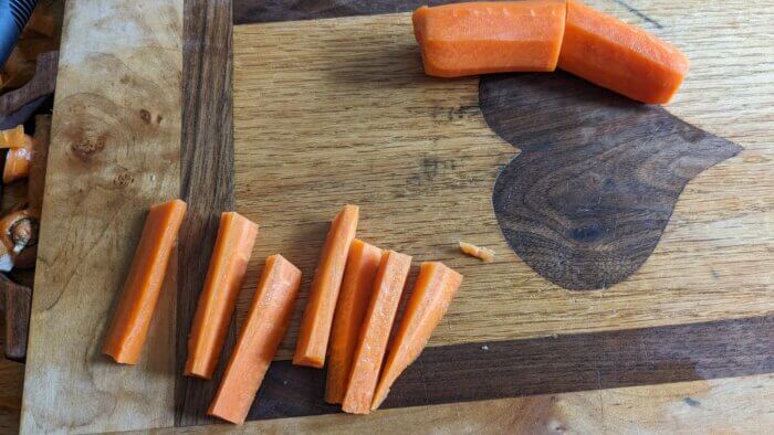 carrots sliced like fries on a cutting board