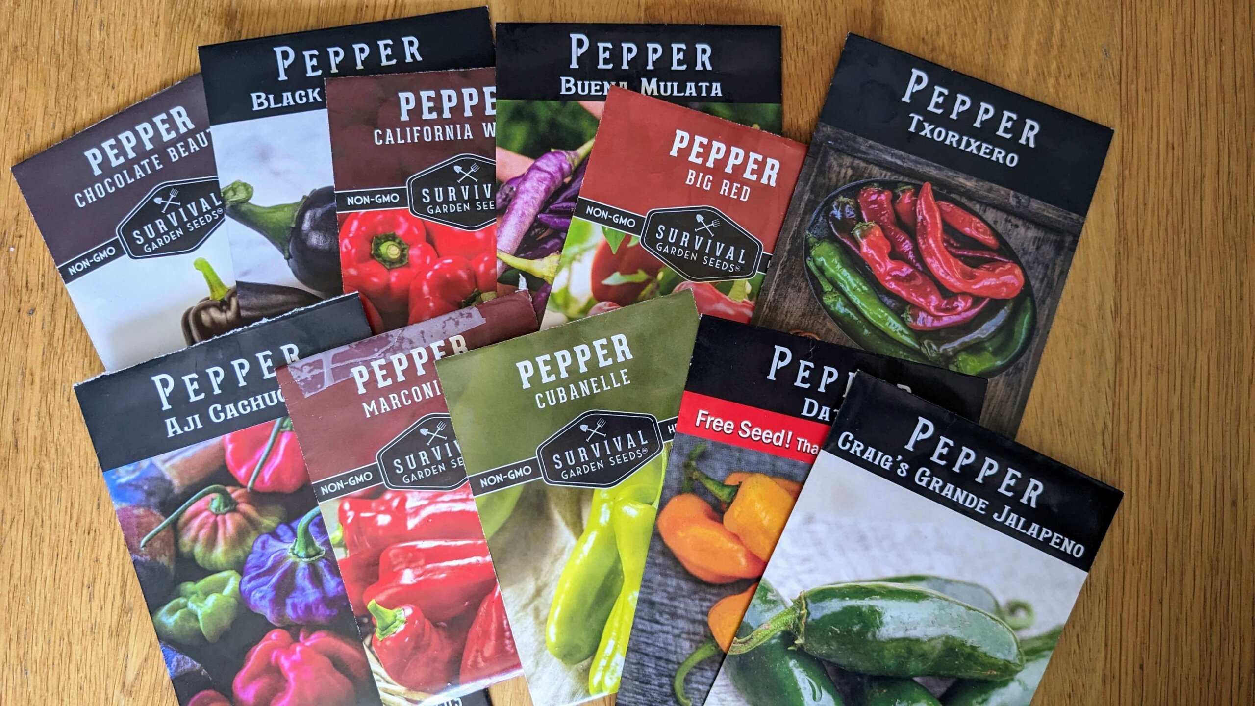 packages of pepper seeds laid out on a counter