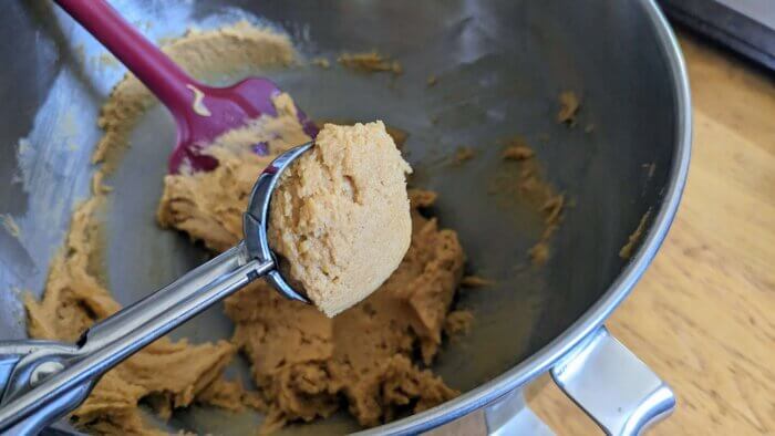 gluten free peanut butter cookie batter in a cookie scoop