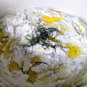 tzatziki sauce topped with olive oil and dill