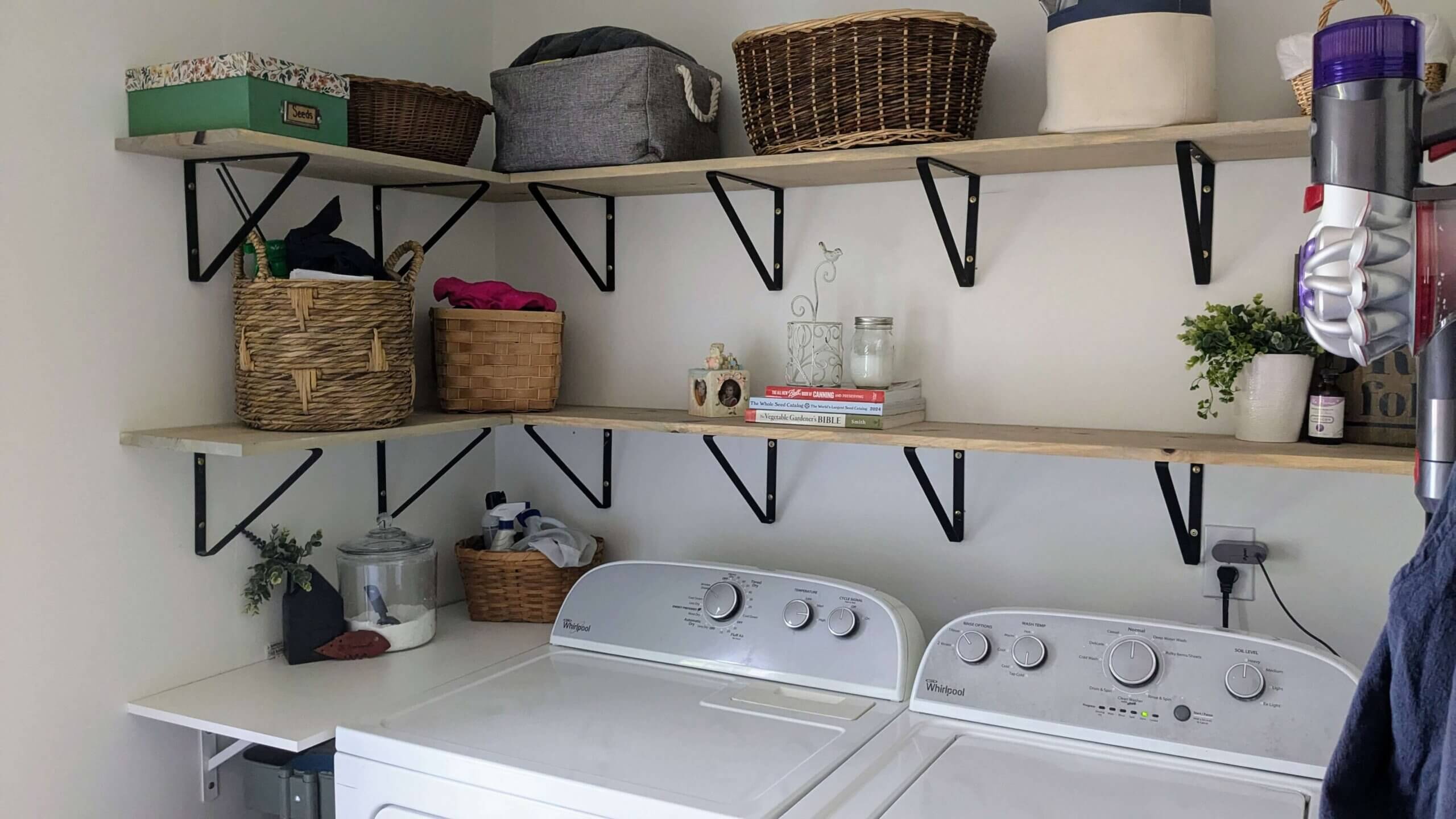 decluttered laundry room with open shelving