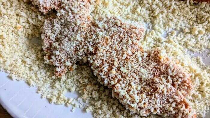 raw chicken in panko bread crumbs