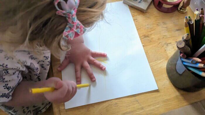 Toddler girl coloring a picture