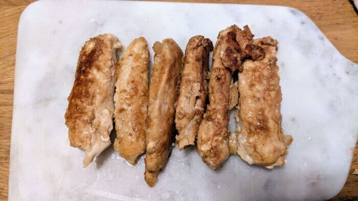 sauteed chicken on a marble cutting board