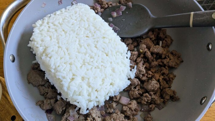 rice and ground beef in a skillet