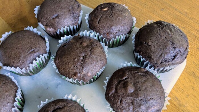 Peanut Butter Cup Sourdough Muffins on a marble cutting board 