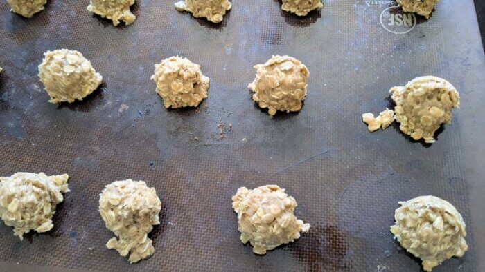 sourdough oatmeal cookie dough in balls on a tray 