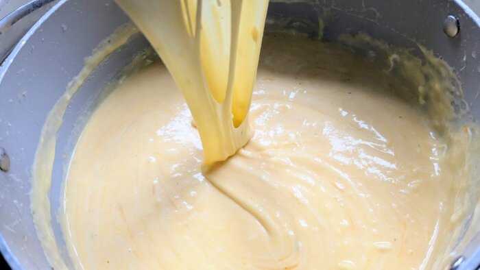 a stretchy, melty, cheese mixture in a pot