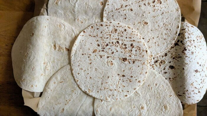 tortilla wraps laid out on a tray